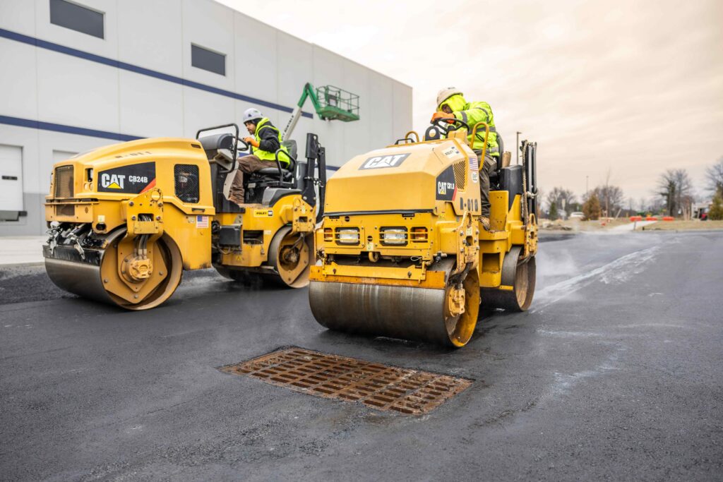 GMP workers on a paving job rolling asphalt